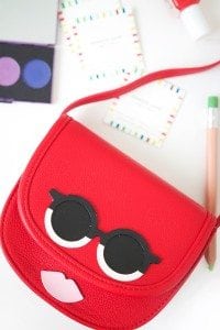 Use your Cricut Explore to create knockoffs of those designer goods. The possibilities are endless with this machine! Create this DIY Designer Crossbody , Tory Burch inspired bag with just a few leather embellishments.