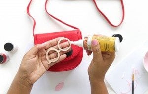 Use your Cricut Explore to create knockoffs of those designer goods. The possibilities are endless with this machine! Create this DIY Designer Crossbody , Tory Burch inspired bag with just a few leather embellishments.