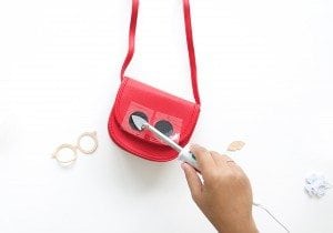 Use your Cricut Explore to create knockoffs of those designer goods. The possibilities are endless with this machine! Create this DIY Designer Crossbody , Tory Burch inspired bag with just a few leather embellishments.