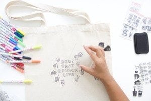 Use a few supplies to create a customized diy stamped canvas tote bag that you can color with fabric markers