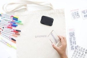 Use a few supplies to create a customized diy stamped canvas tote bag that you can color with fabric markers