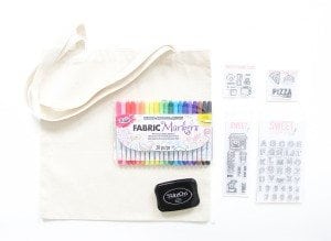 Use a few supplies to create a customized diy stamped canvas tote bag that you can color with fabric markers