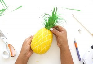 Mimic the look of taxidermy with a paper mache egg and some paint. This 3D diy paper mache pineapple wall art is a show stopper and a perfect addition to your gallery wall.