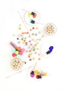 Grab some paint and learn how to paint wooden beads in a variety of different patterns..