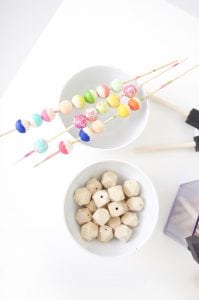 Grab some paint and learn how to paint wooden beads in a variety of different patterns..