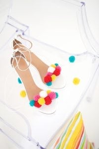 recreate this seasons hottest footwear by making your own DIY pom pom sandals. They will turn heads and save you a ton of money!
