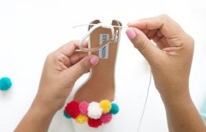 recreate this seasons hottest footwear by making your own DIY pom pom sandals. They will turn heads and save you a ton of money!