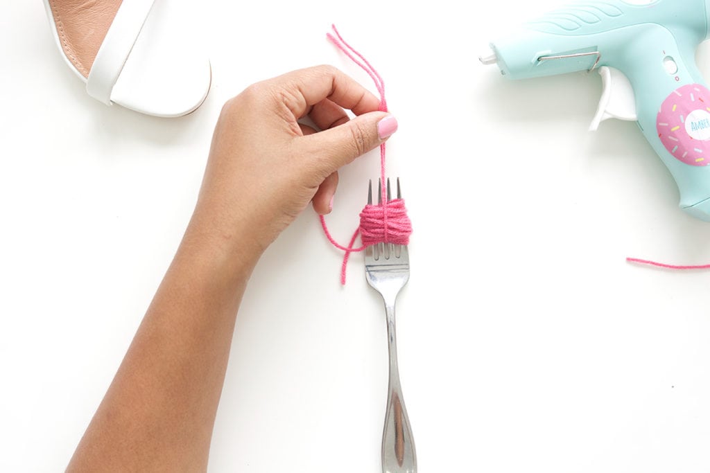 recreate this seasons hottest footwear by making your own DIY pom pom sandals. They will turn heads and save you a ton of money!