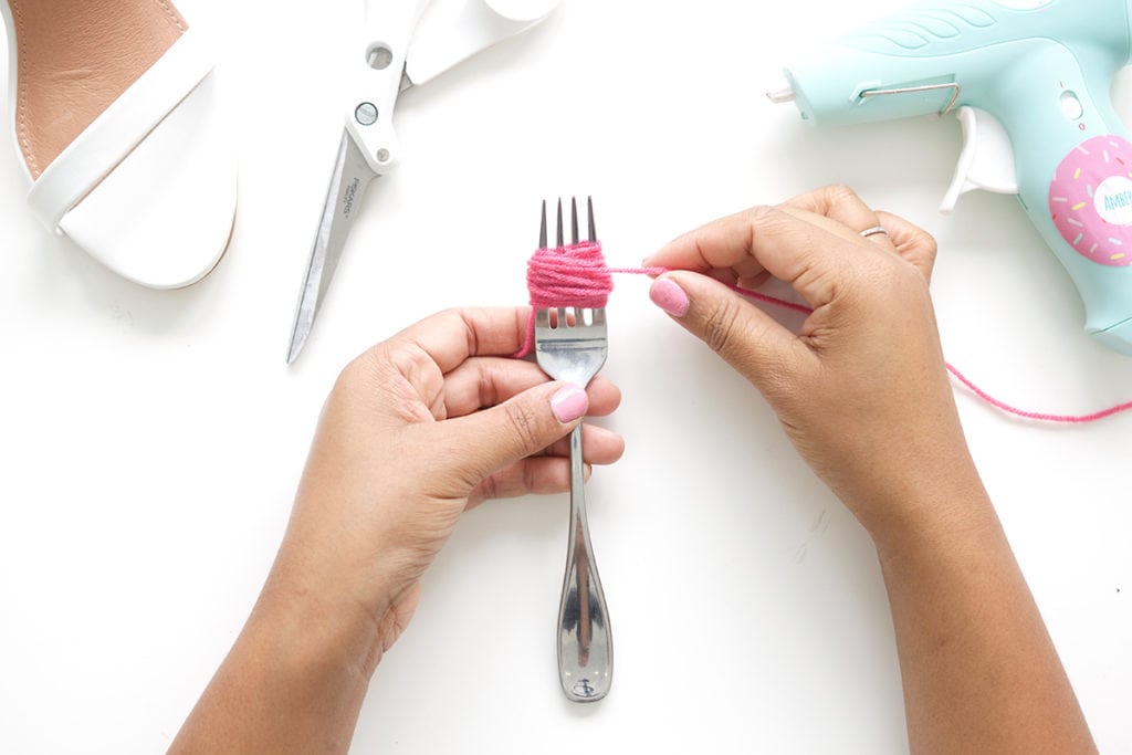 recreate this seasons hottest footwear by making your own DIY pom pom sandals. They will turn heads and save you a ton of money!