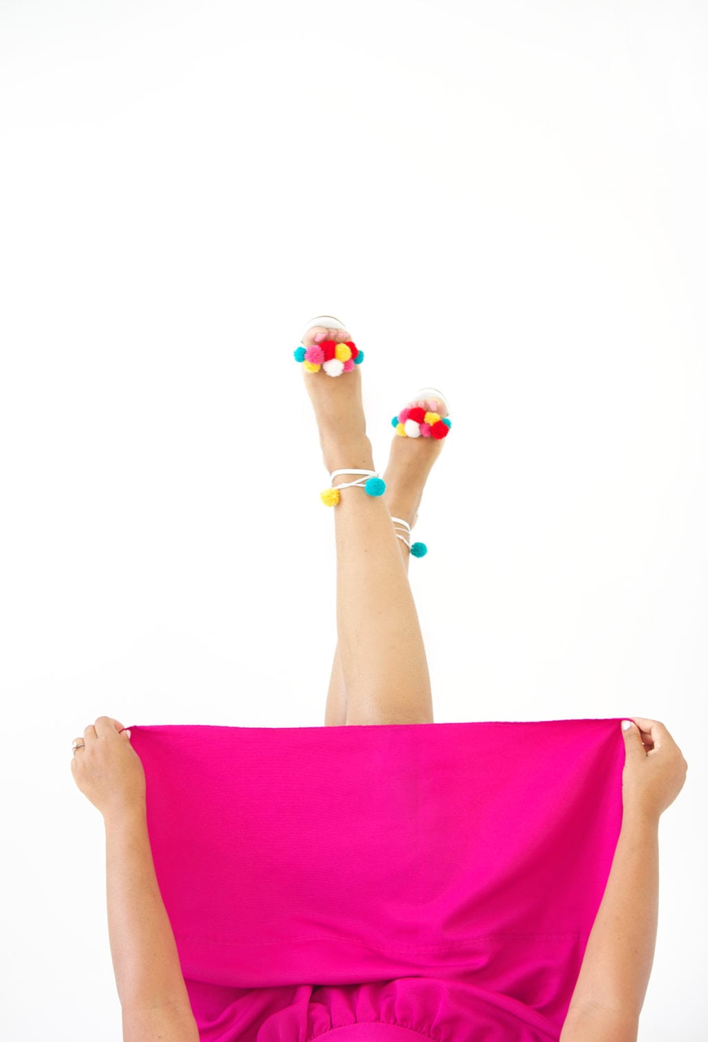 recreate this seasons hottest footwear by making your own DIY pom pom sandals. They will turn heads and save you a ton of money!