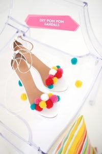 recreate this seasons hottest footwear by making your own DIY pom pom sandals. They will turn heads and save you a ton of money!