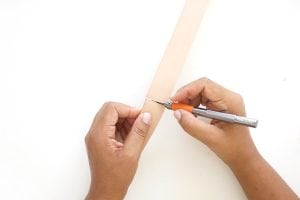 Transform a regular canvas tote bag into a DIY Leather Strap Tote Bag with the addition of leather and a few basic crafting supplies.