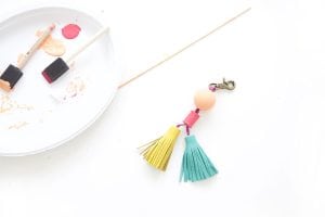 Tassels will never go out of style so why not create these leather and wood bead tassels in just a few steps.Your tote bag will thank you.