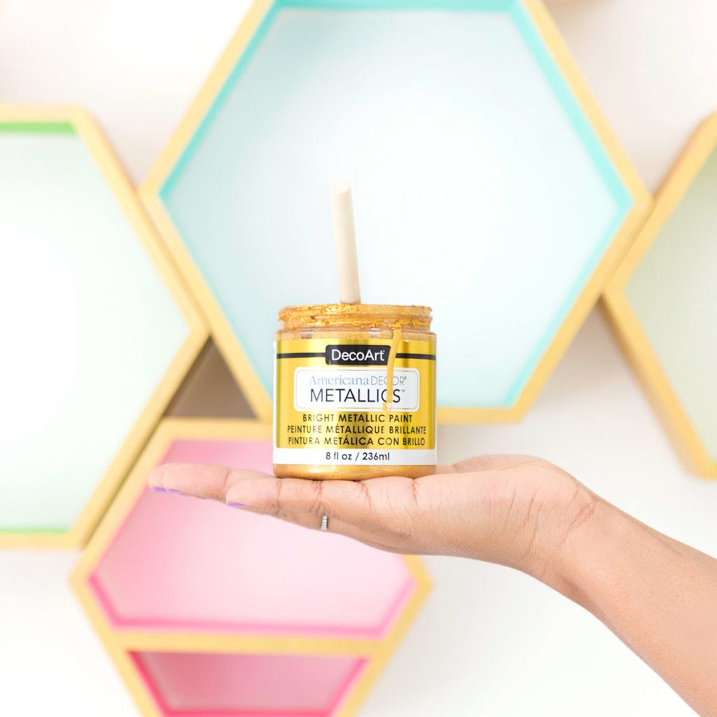 Create these DecoArt Metallic Hexagon Wall Shelves using DecoArt gold metallic paints to add perfect shimmer to your office walls.