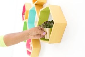 Create these DecoArt Metallic Hexagon Wall Shelves using DecoArt gold metallic paints to add perfect shimmer to your office walls.