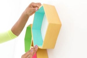 Create these DecoArt Metallic Hexagon Wall Shelves using DecoArt gold metallic paints to add perfect shimmer to your office walls.