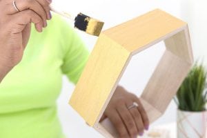 Create these DecoArt Metallic Hexagon Wall Shelves using DecoArt gold metallic paints to add perfect shimmer to your office walls.