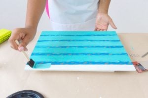 Enjoy the outdoors with this DIY Wooden Crate Picnic Basket that is easy to create with paint and simple tools. Great for enjoying the end of summer.
