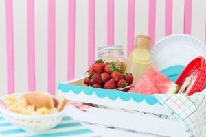 Enjoy the outdoors with this DIY Wooden Crate Picnic Basket that is easy to create with paint and simple tools. Great for enjoying the end of summer.